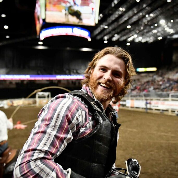 Coy Thorson smiles after his ride on Big Bucks ProRodeo's Little Wolf. Image by Chuck Minor